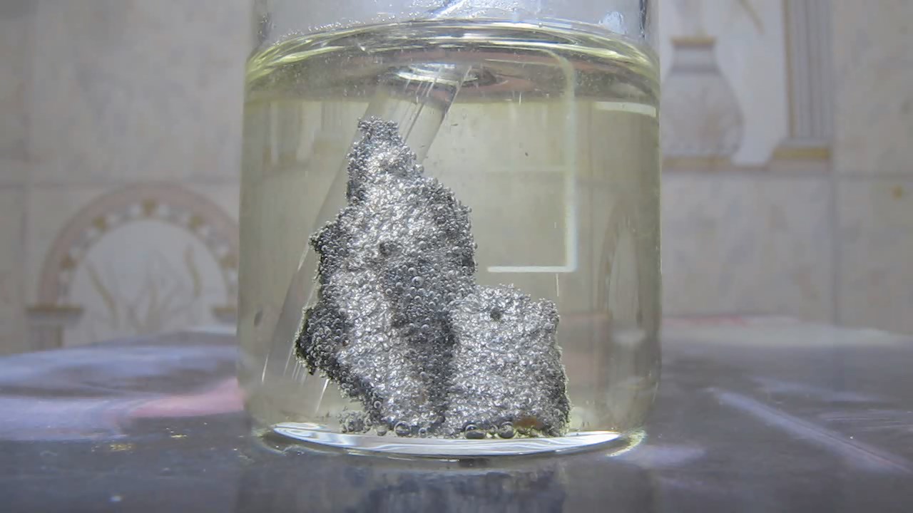      ('' '')   . Reaction of alloy of nickel and phosphorus (''nickel phosphide'') with hydrochloric acid