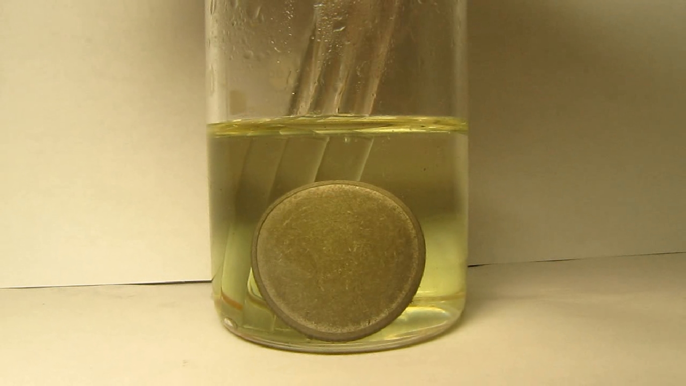 Hydrochloric acid and Ukrainian 2 hryvnias coin.      2 