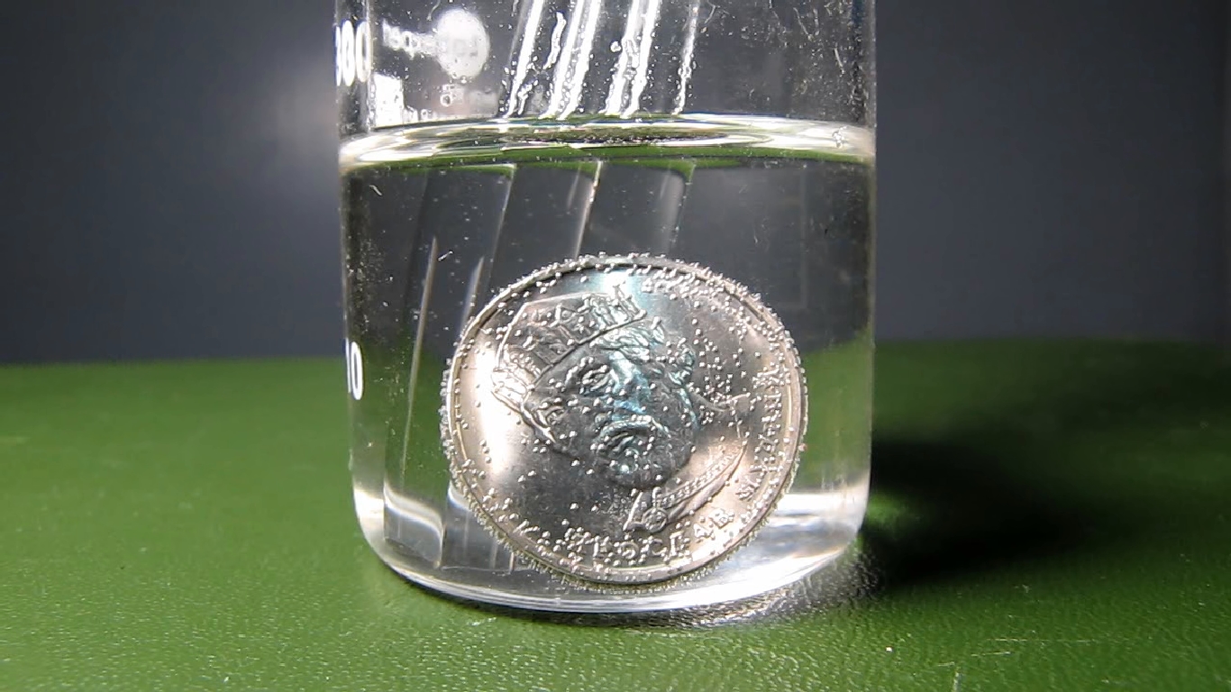 Hydrochloric acid and Ukrainian 2 hryvnias coin. Соляная кислота и украинская монета 2 гривны