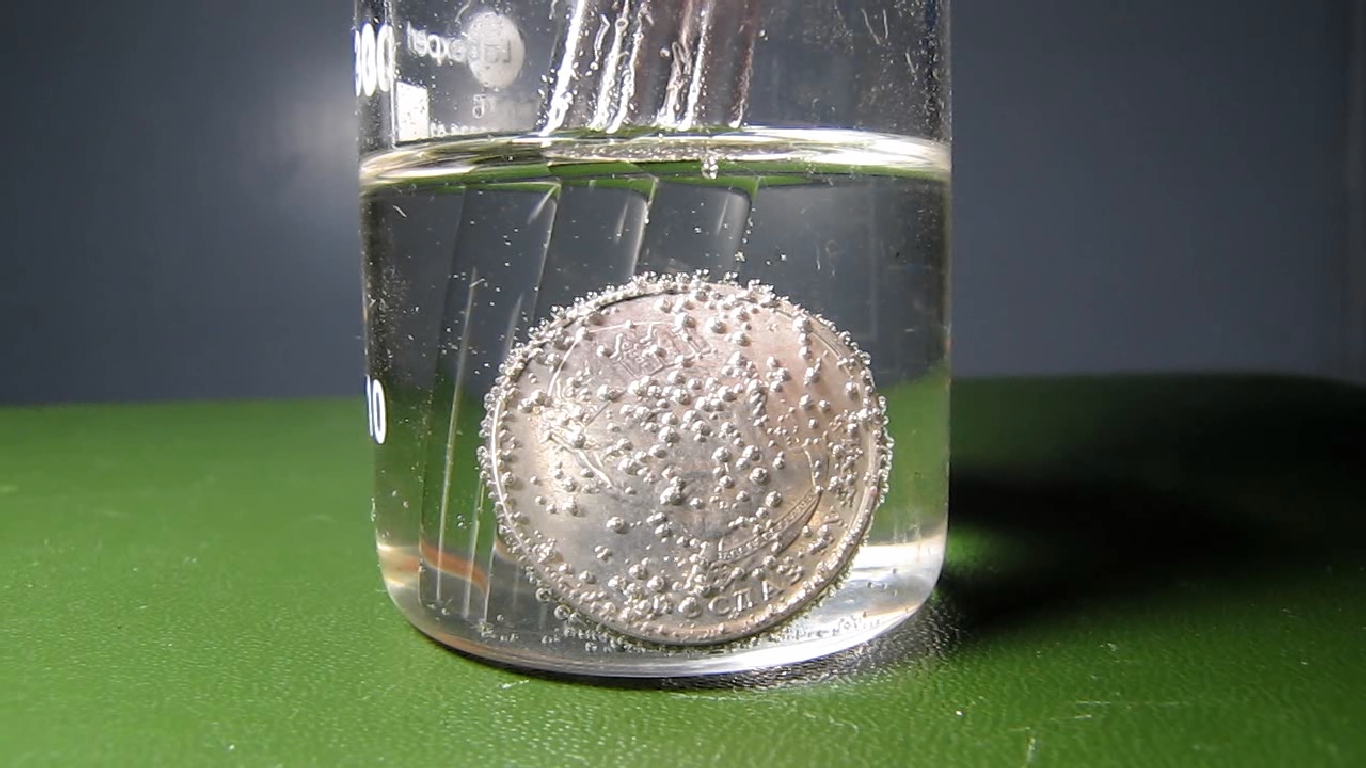 Hydrochloric acid and Ukrainian 2 hryvnias coin.      2 