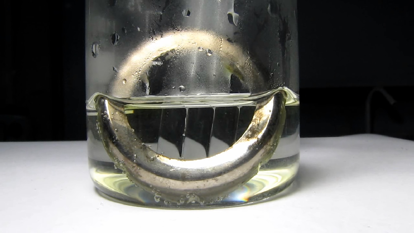 Metallic coating on plastic (copper - nickel - chrome): reaction with hydrochloric acid.     ( -  - ):    