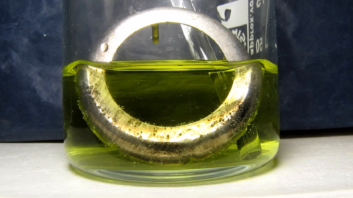 Metallic coating on plastic (copper - nickel - chrome): reaction with hydrochloric acid.     ( -  - ):    