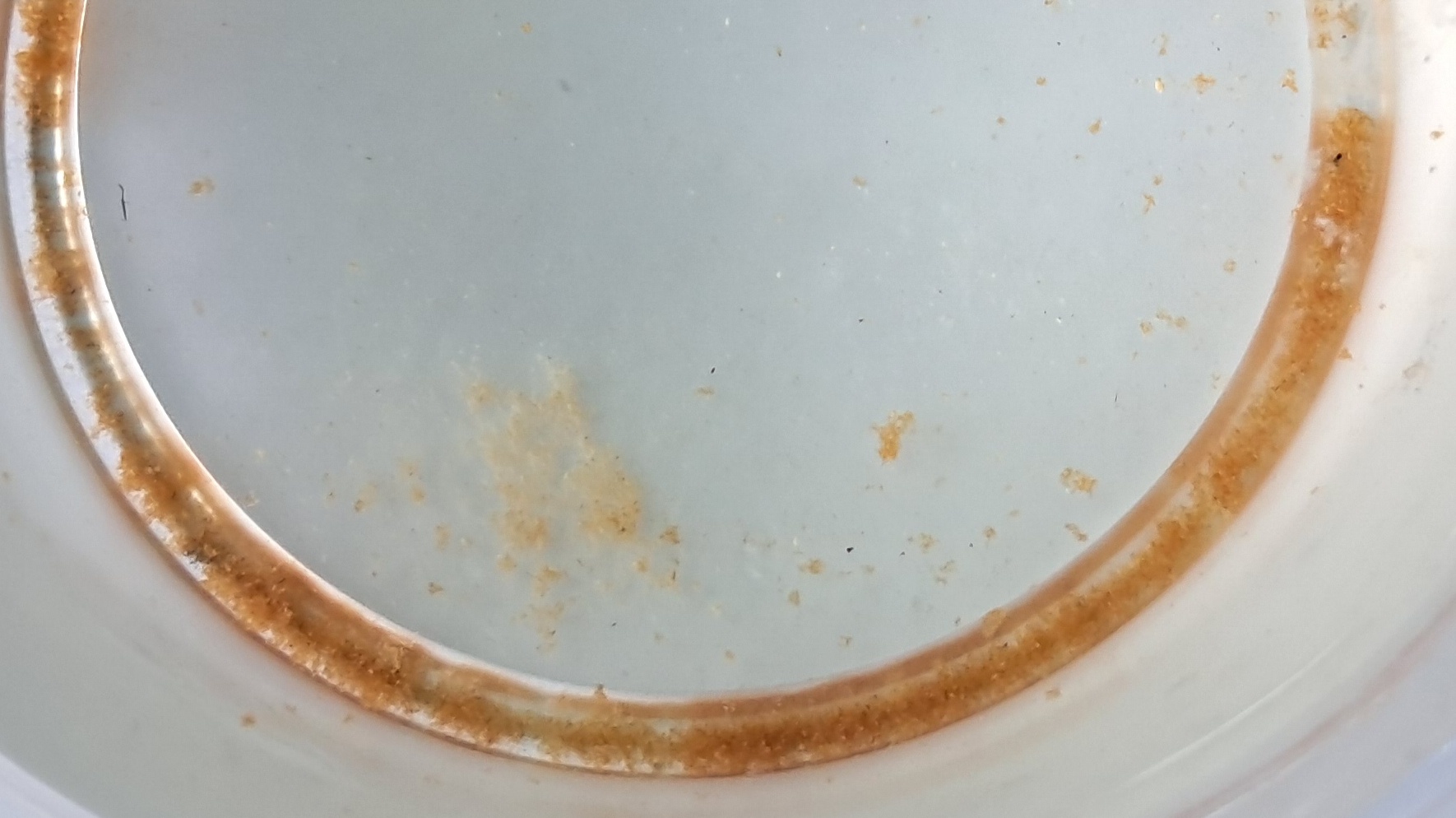 Precipitation of iron(III) hydroxide during freezing of water