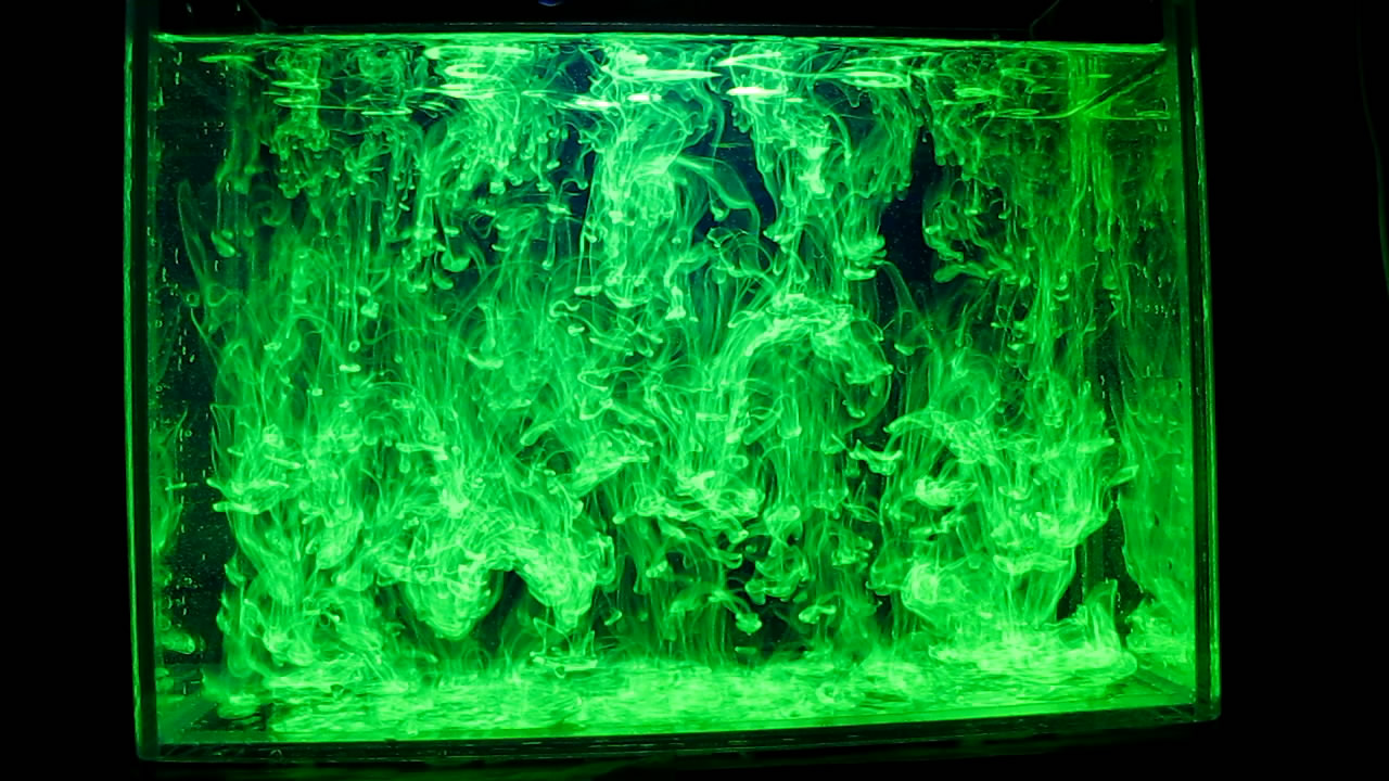     ( ). Fluorescein under ultraviolet light (vortex rings)