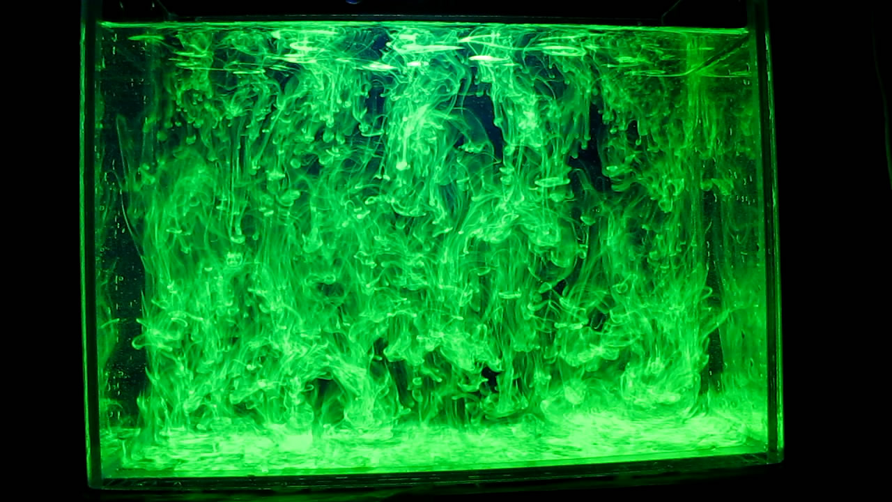     ( ). Fluorescein under ultraviolet light (vortex rings)