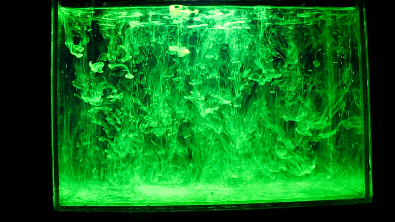     ( ). Fluorescein under ultraviolet light (vortex rings)