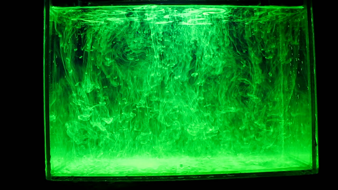     ( ). Fluorescein under ultraviolet light (vortex rings)