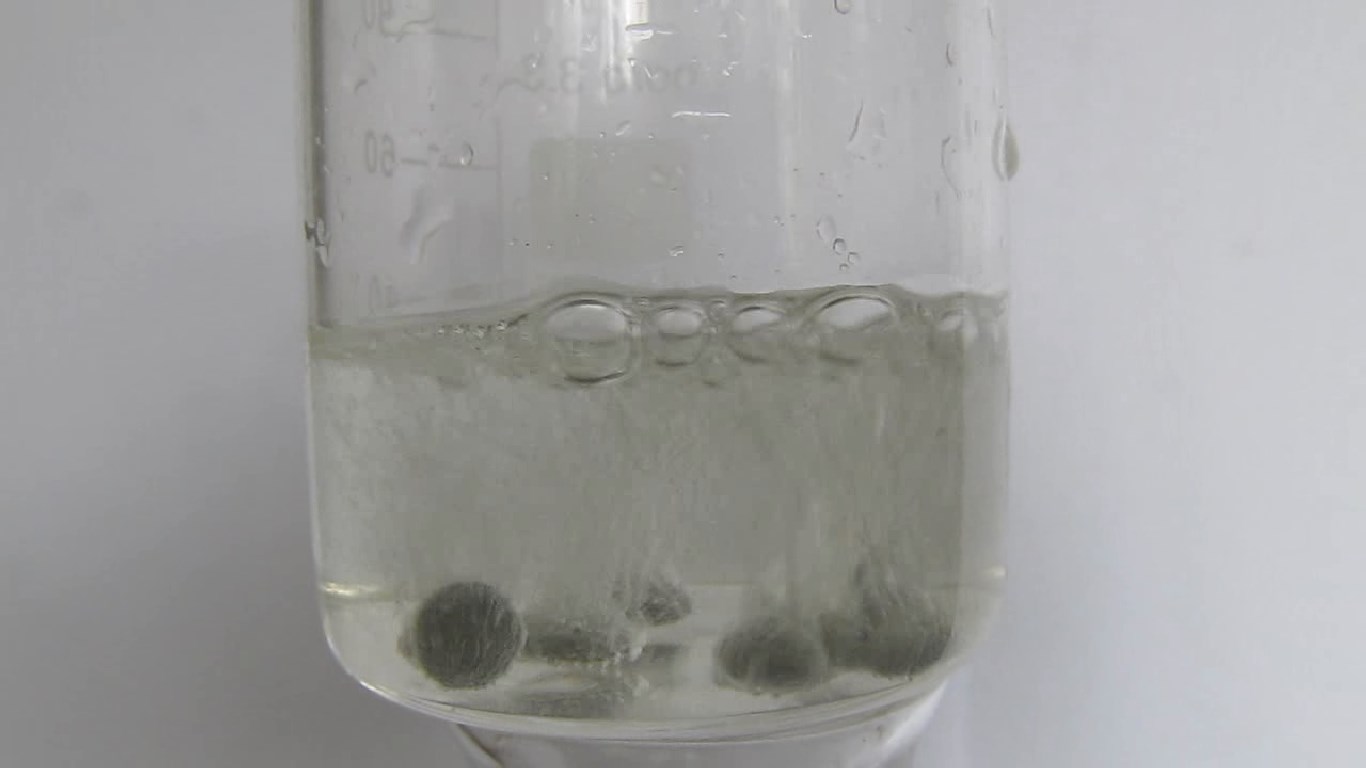         . Reduction of ammonium molybdate by zinc and hydrochloric acid