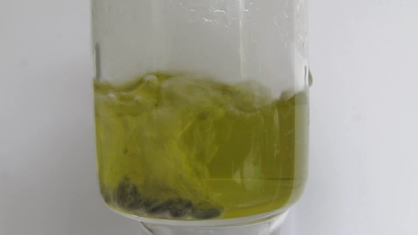         . Reduction of ammonium molybdate by zinc and hydrochloric acid