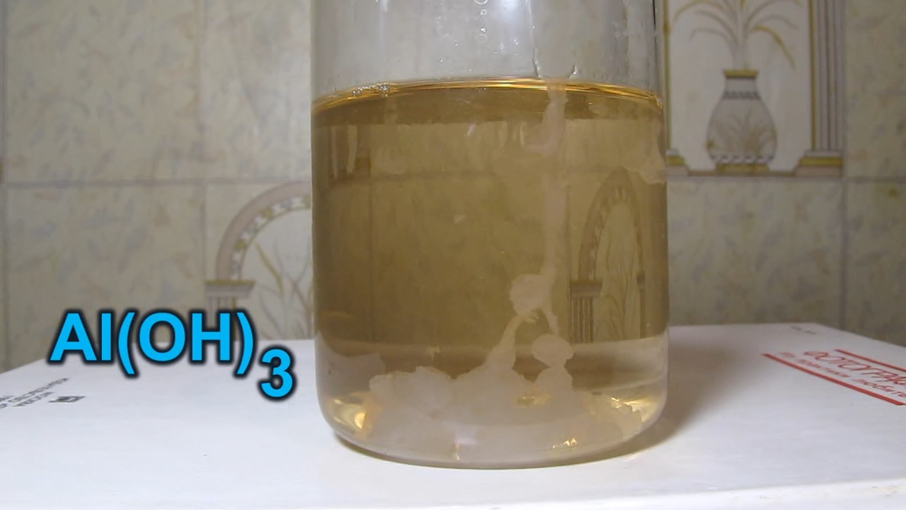 Potassium aluminate K[Al(OH)4] and nitric acid.   K[Al(OH)4]   