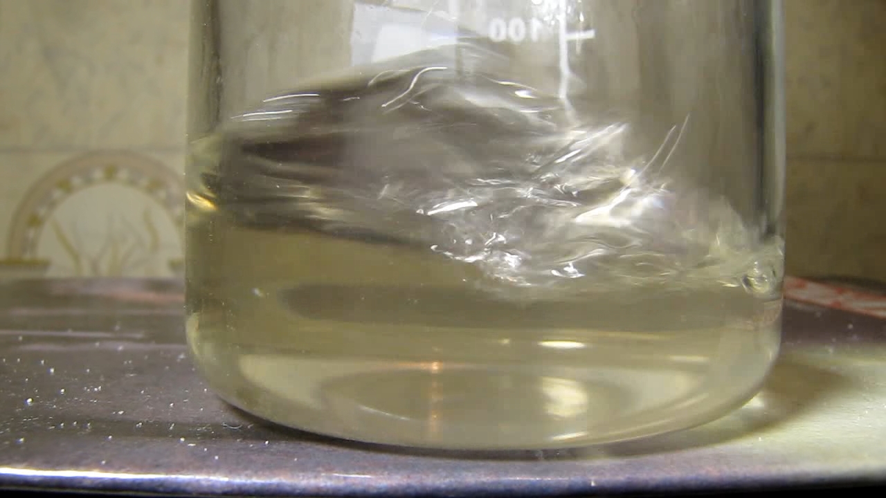 Reaction of concentrated nitric acid and solid potassium hydroxide.        