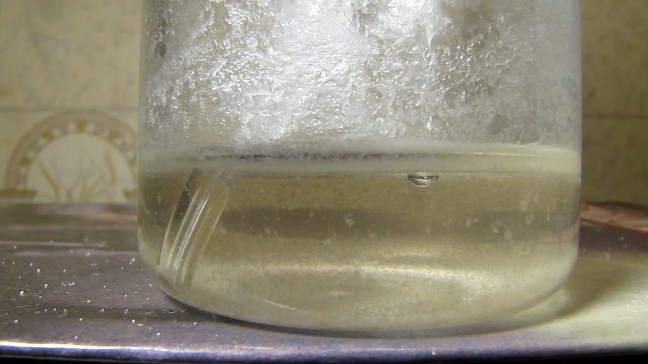 Reaction of concentrated nitric acid and solid potassium hydroxide.        