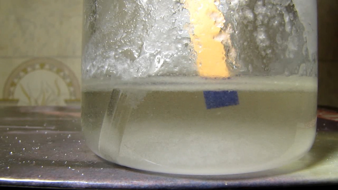 Reaction of concentrated nitric acid and solid potassium hydroxide.        