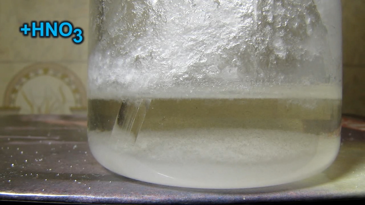 Reaction of concentrated nitric acid and solid potassium hydroxide.        