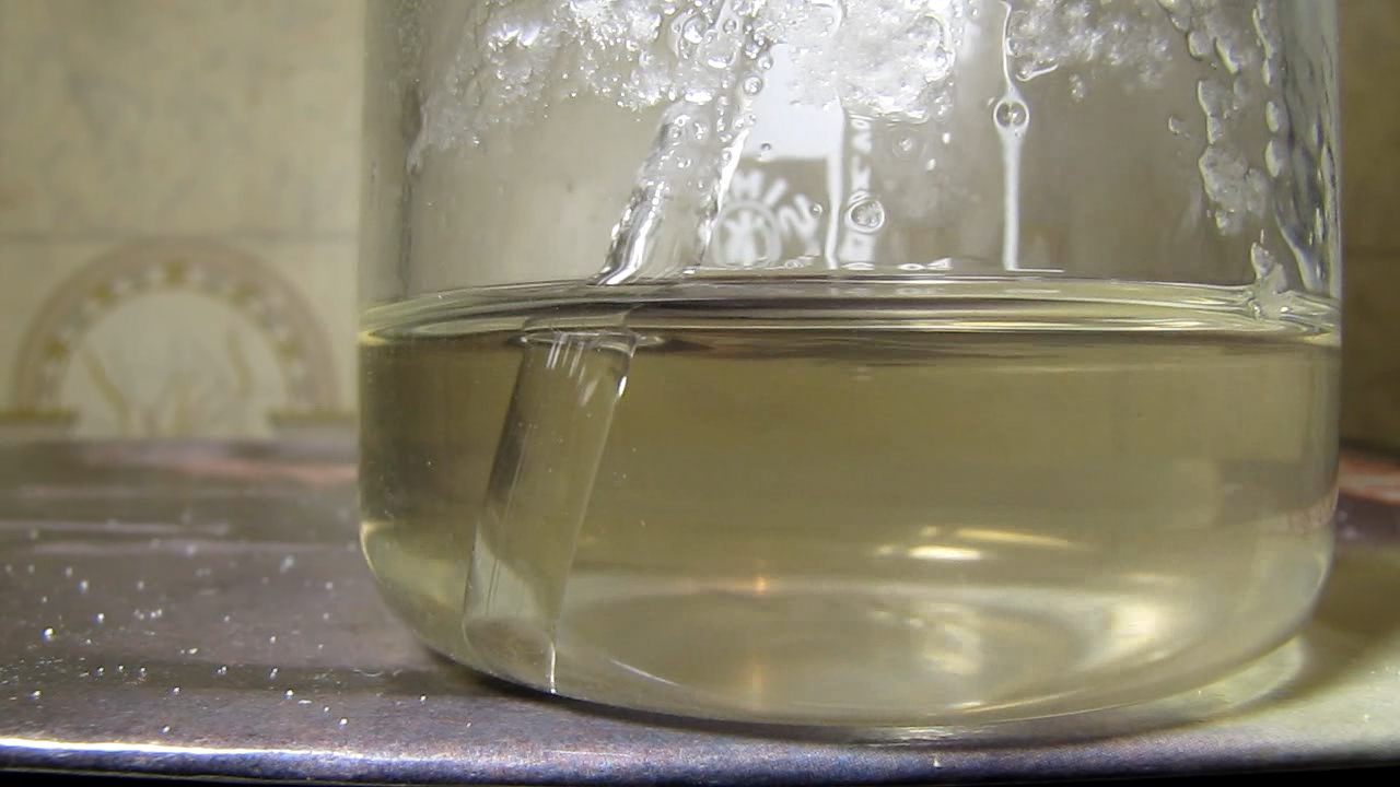 Reaction of concentrated nitric acid and solid potassium hydroxide.        