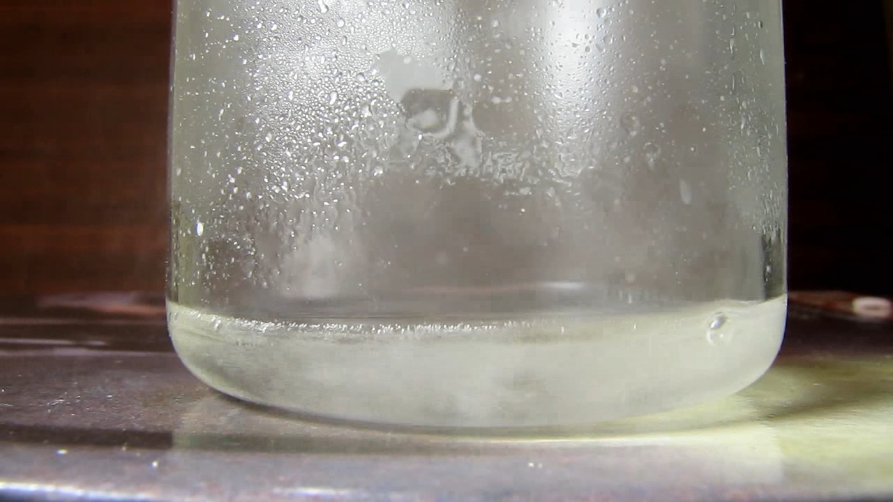 Reaction of concentrated nitric acid and solid potassium hydroxide.        