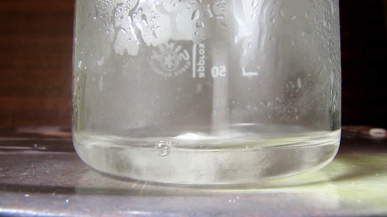 Reaction of concentrated nitric acid and solid potassium hydroxide.        