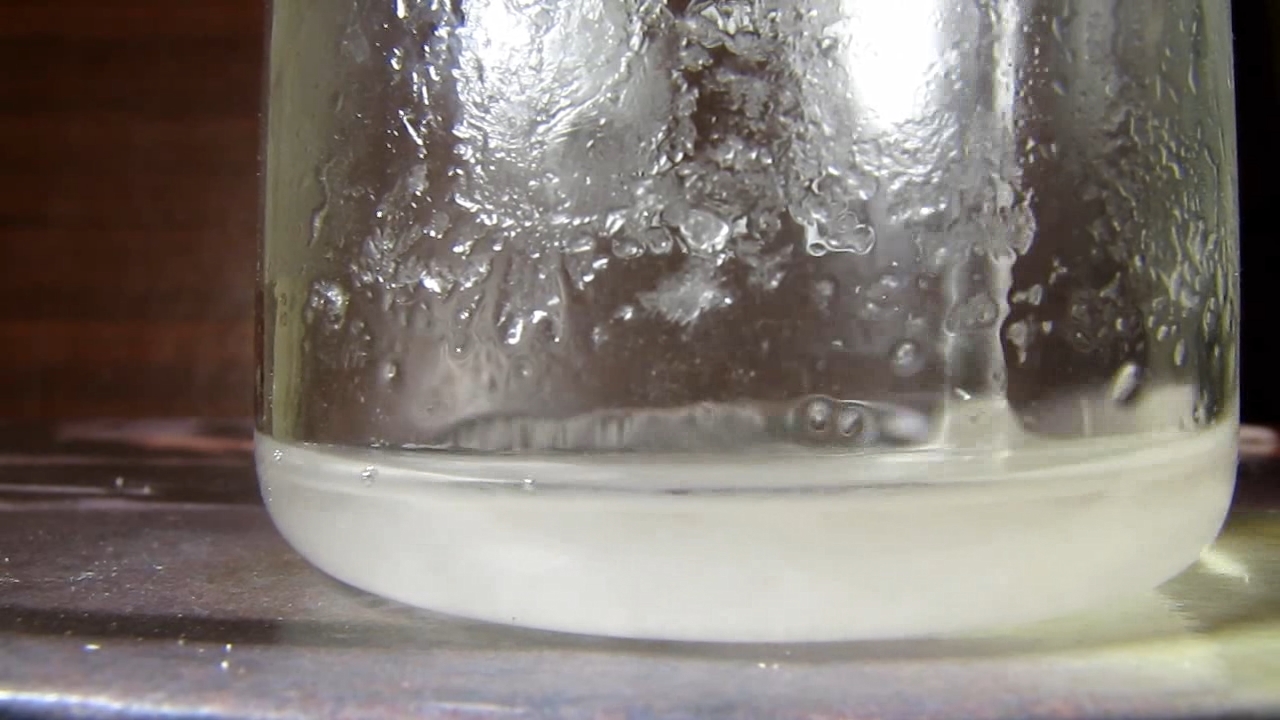 Reaction of concentrated nitric acid and solid potassium hydroxide.        