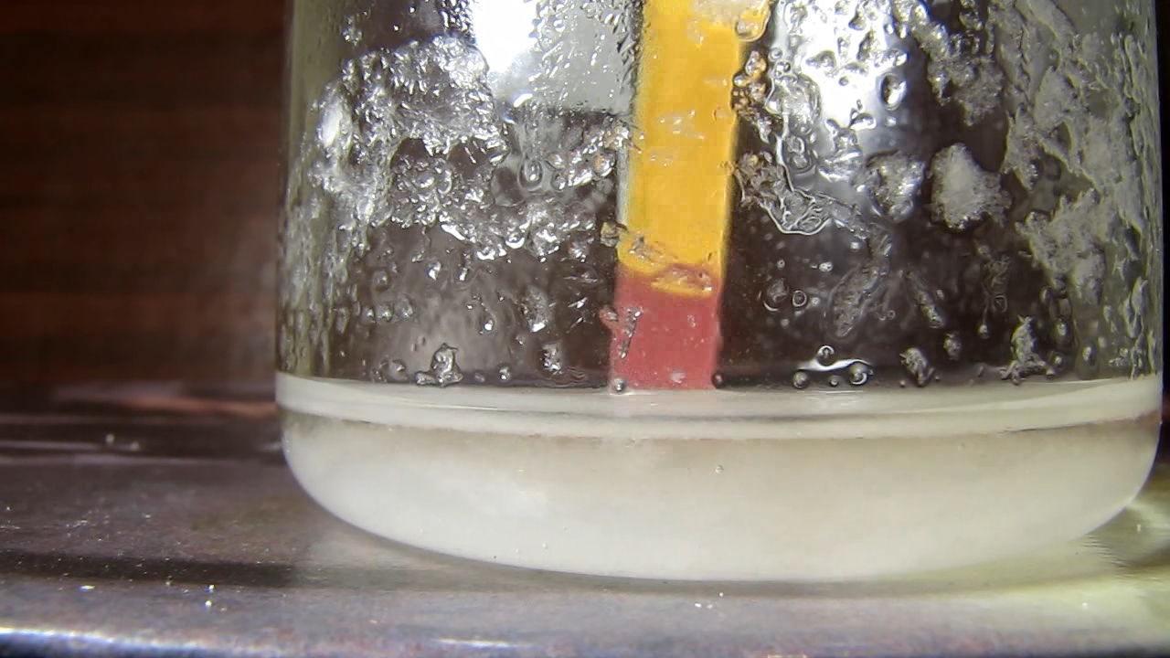 Reaction of concentrated nitric acid and solid potassium hydroxide.        