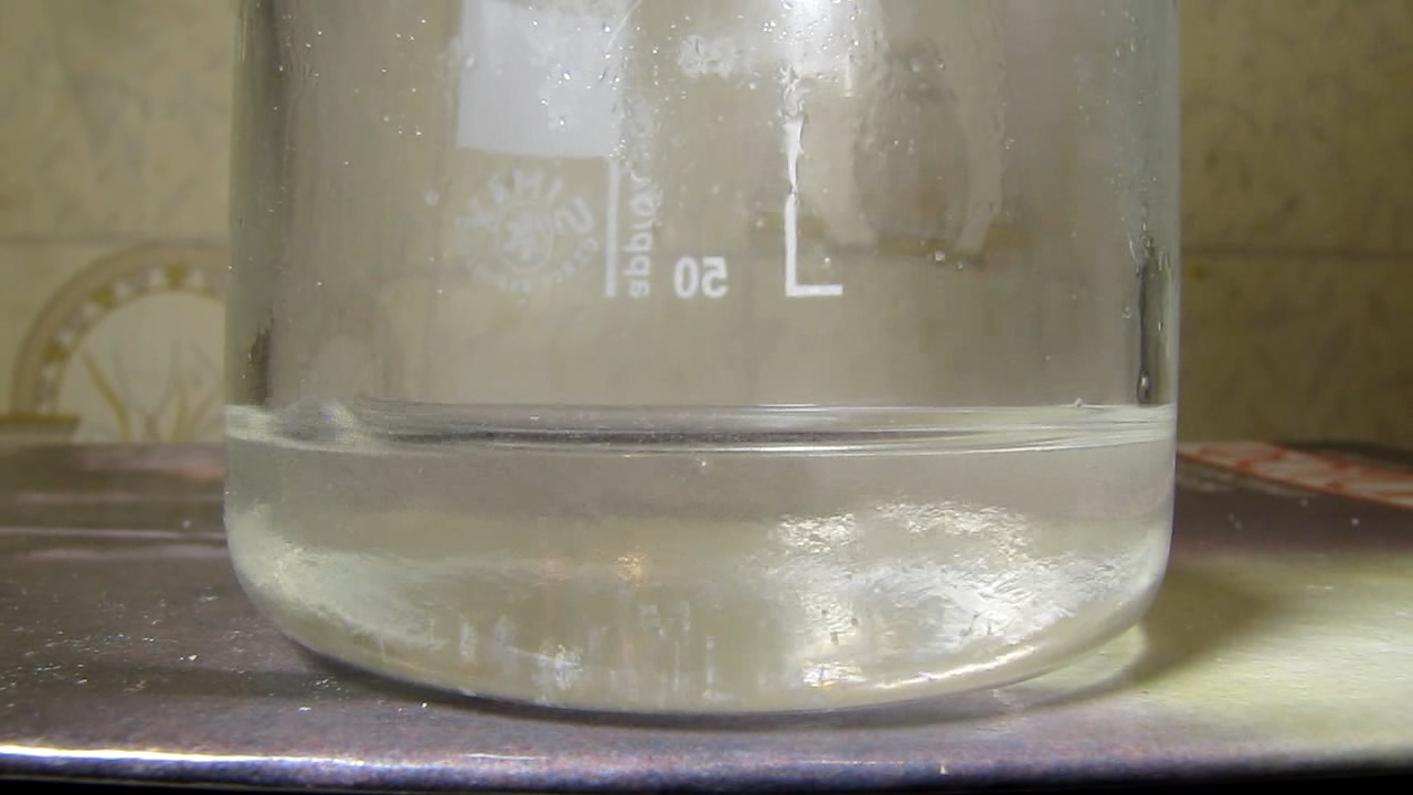 Reaction of concentrated nitric acid and solid potassium hydroxide.        