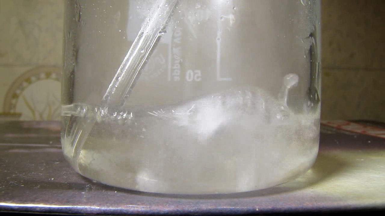 Reaction of concentrated nitric acid and solid potassium hydroxide.        