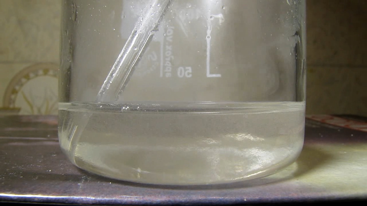 Reaction of concentrated nitric acid and solid potassium hydroxide.        