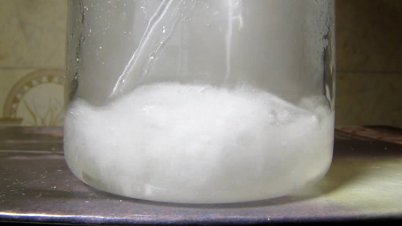 Reaction of concentrated nitric acid and solid potassium hydroxide.        