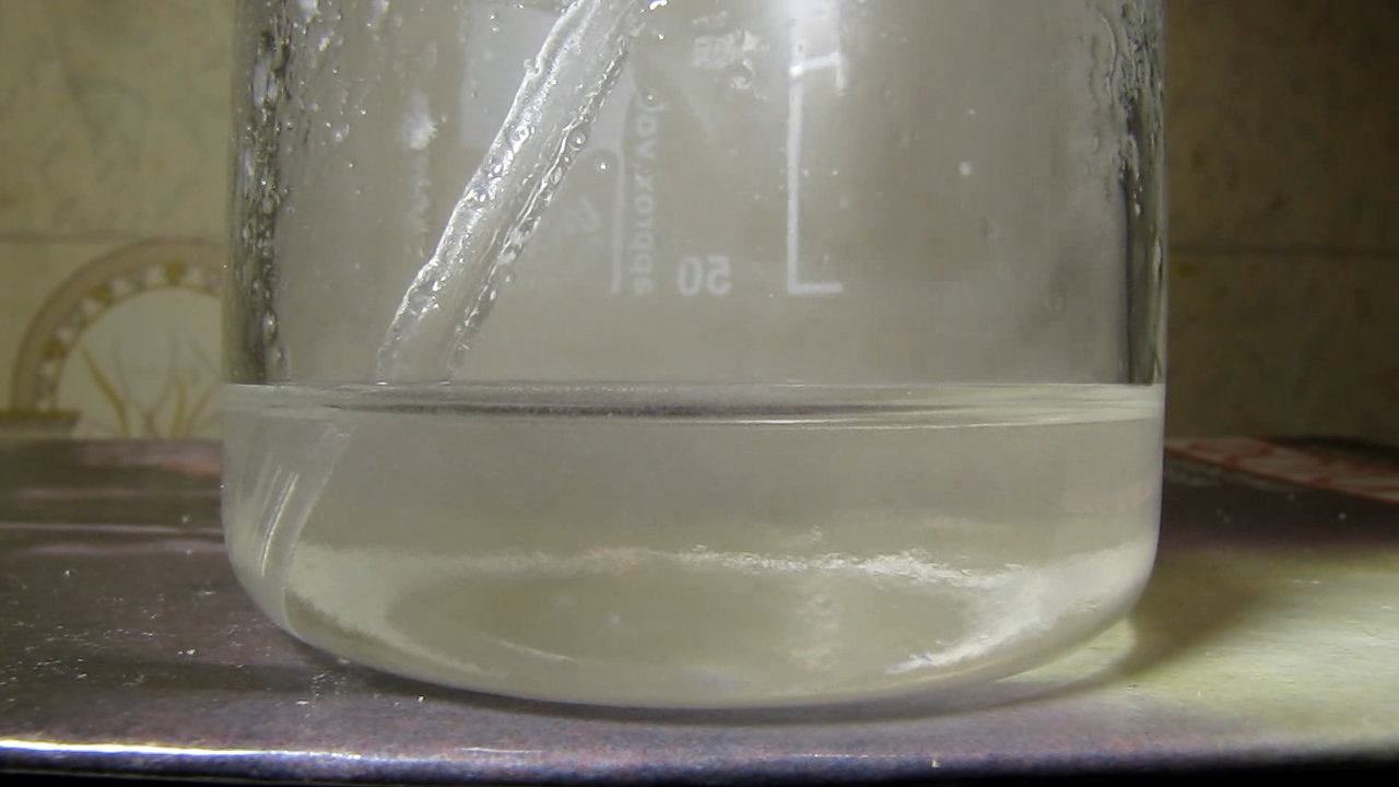 Reaction of concentrated nitric acid and solid potassium hydroxide.        