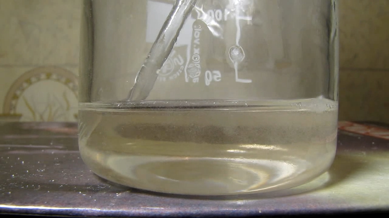 Reaction of concentrated nitric acid and solid potassium hydroxide.        