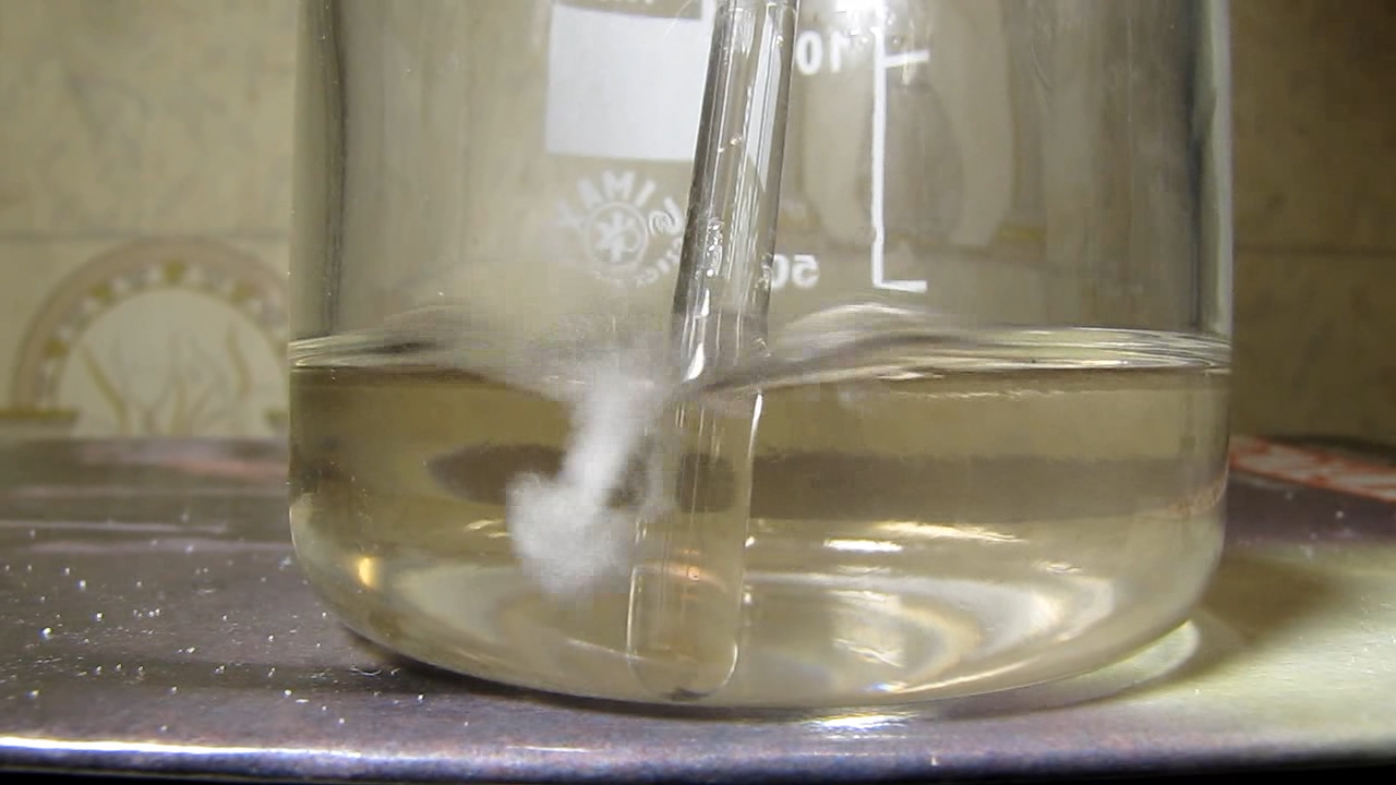 Reaction of concentrated nitric acid and solid potassium hydroxide.        