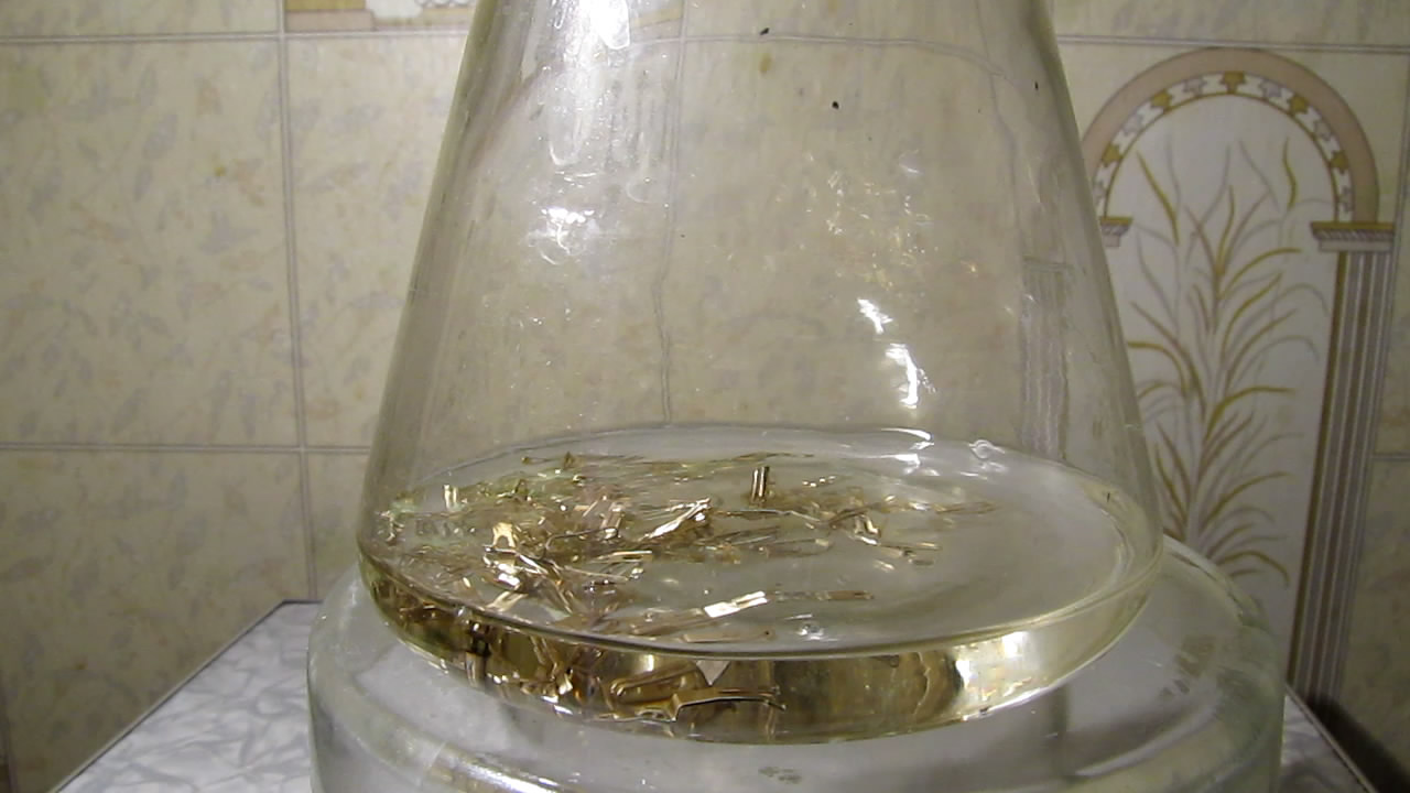 Gold-plated electrical contacts and nitric acid.     