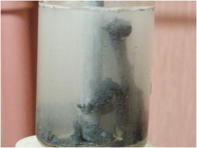      . The precipitation of metallic zinc from an aqueous solution
