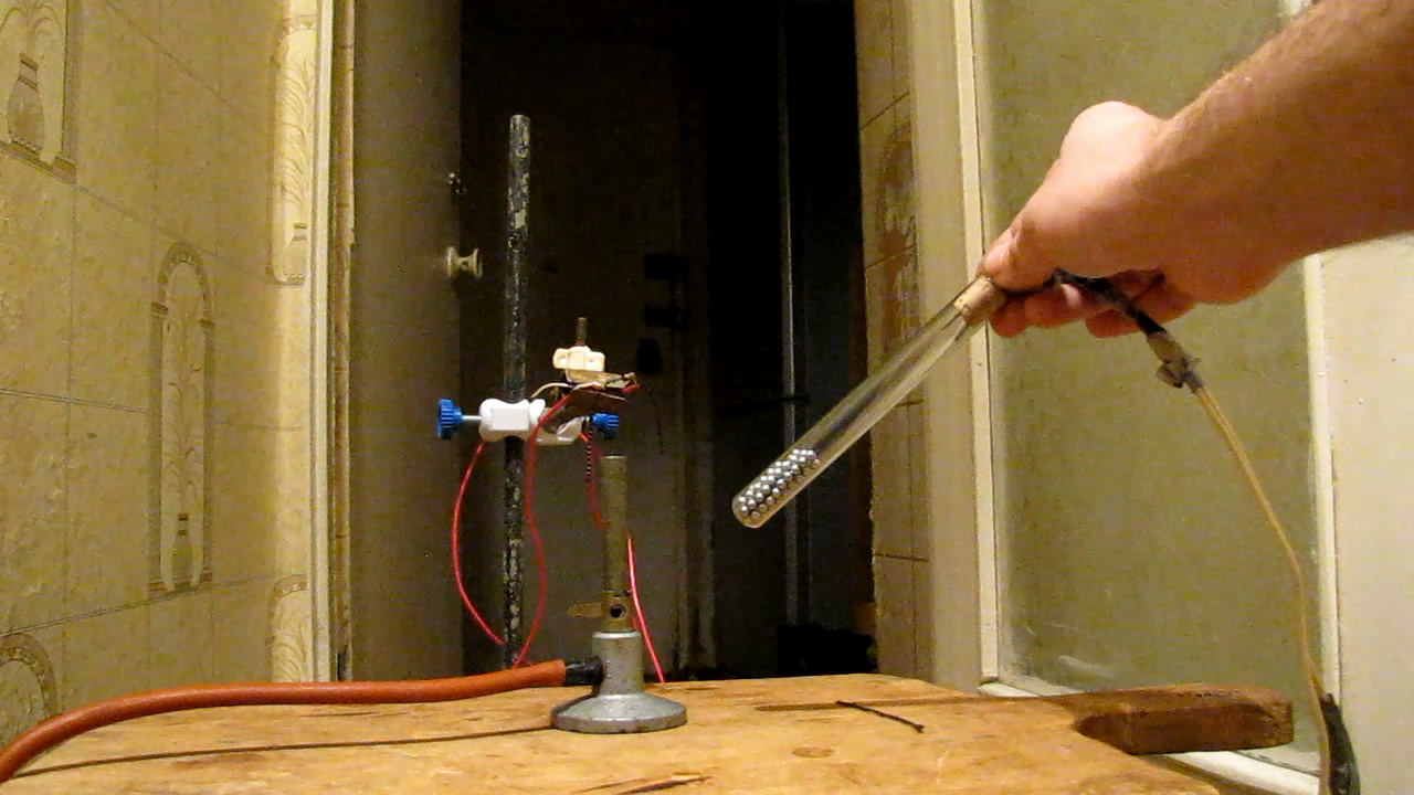      . The model of a mercury tilt switch and a Bunsen burner