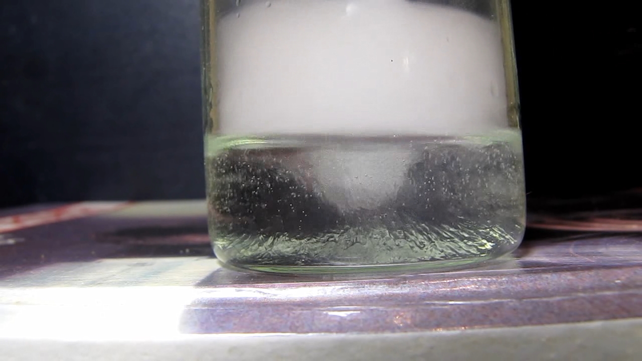 Aluminium hydroxide (after ageing of precipitate) and acetic acid