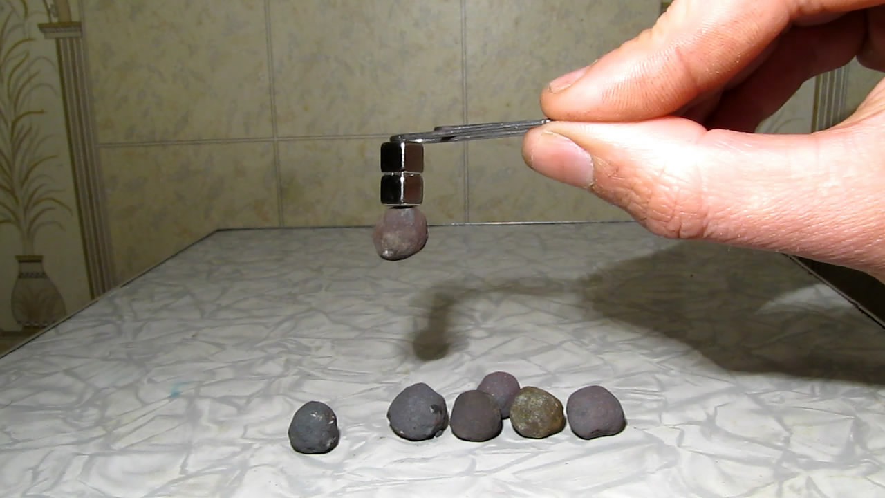    . Neodymium magnet and iron ore pellets