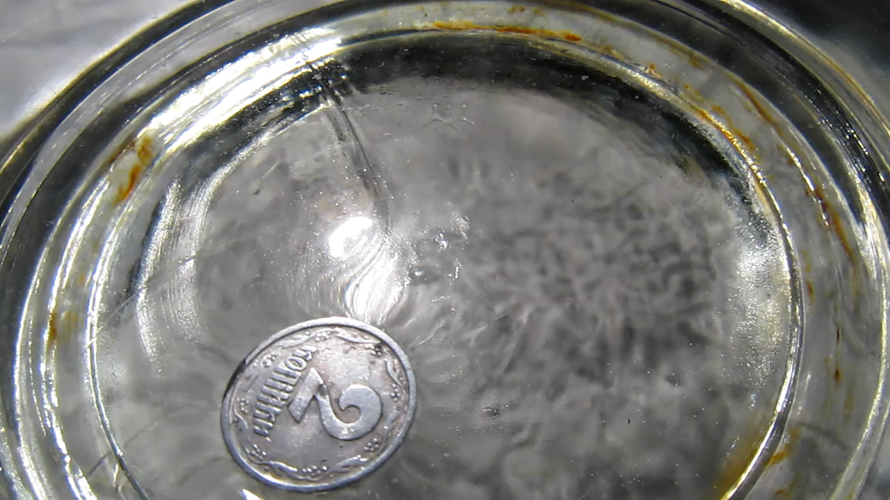     . Floating coin (surface tension)