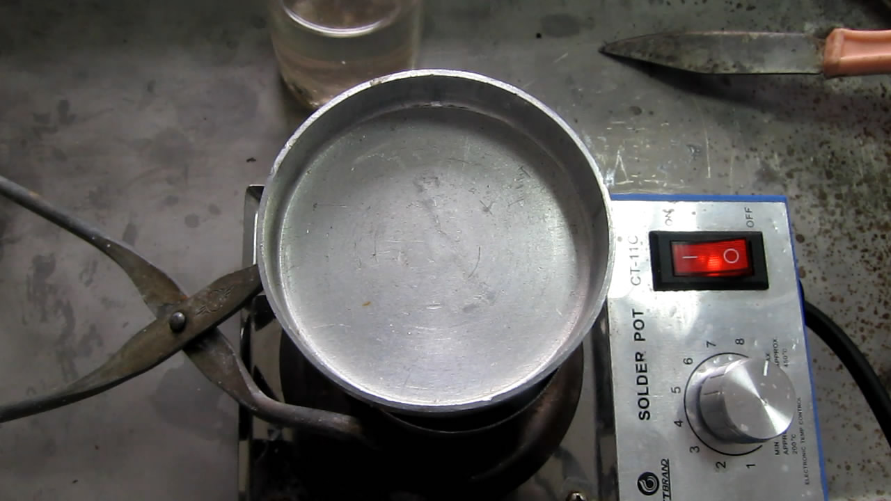   ( ). Melting of sodium (in crucible)