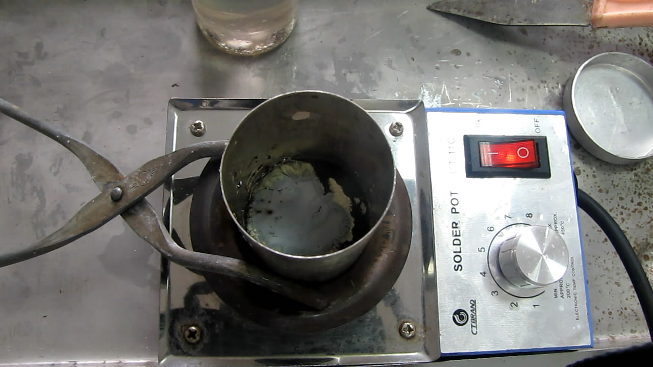   ( ). Melting of sodium (in crucible)