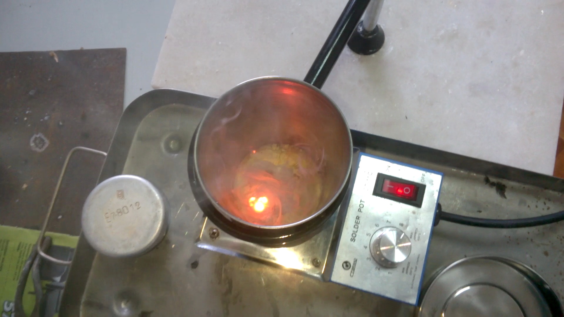   ( ). Melting of sodium (in crucible)