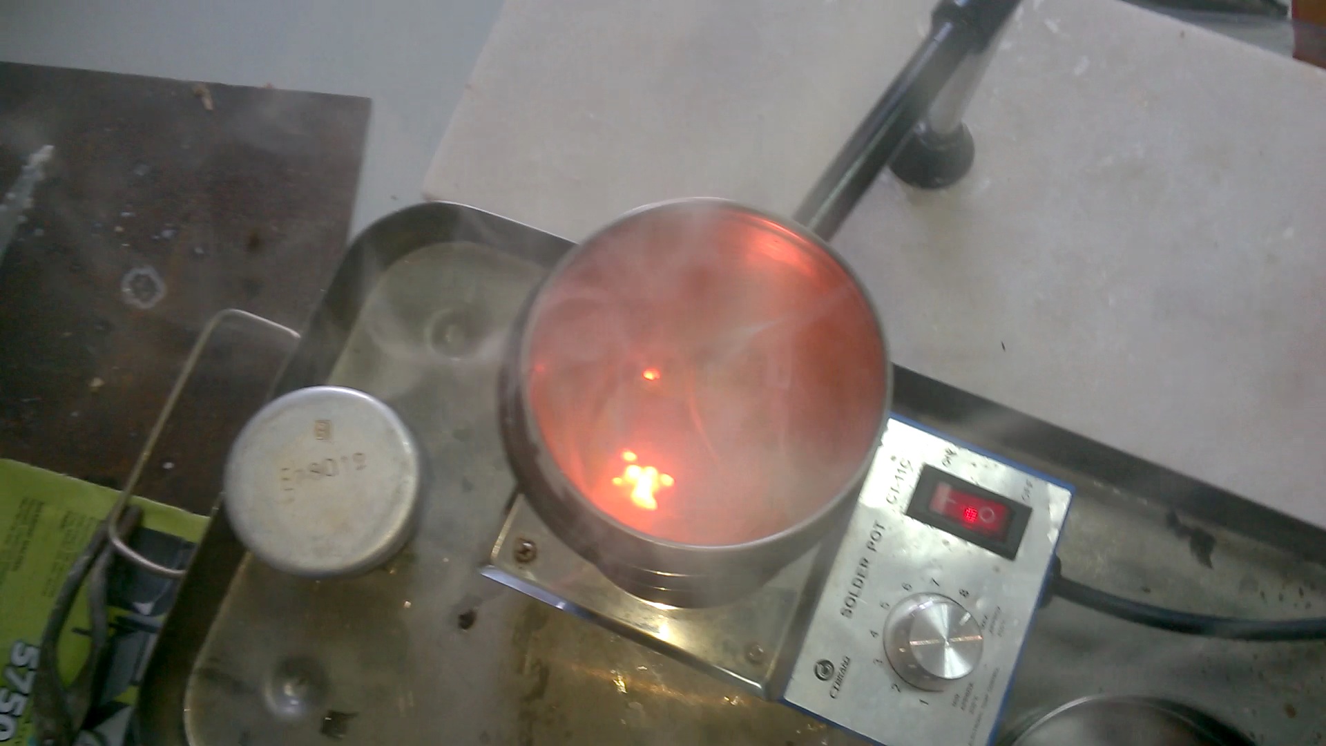   ( ). Melting of sodium (in crucible)