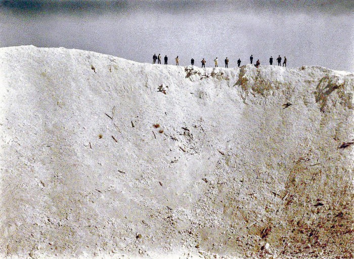 ers-look-at-the-45-meter-deep-crater-left-by-the-detonation-by-the-British-of-21-tons-of-explosives-underneath-German-positions-near-Messines-in-West-Flanders.[1].jpg